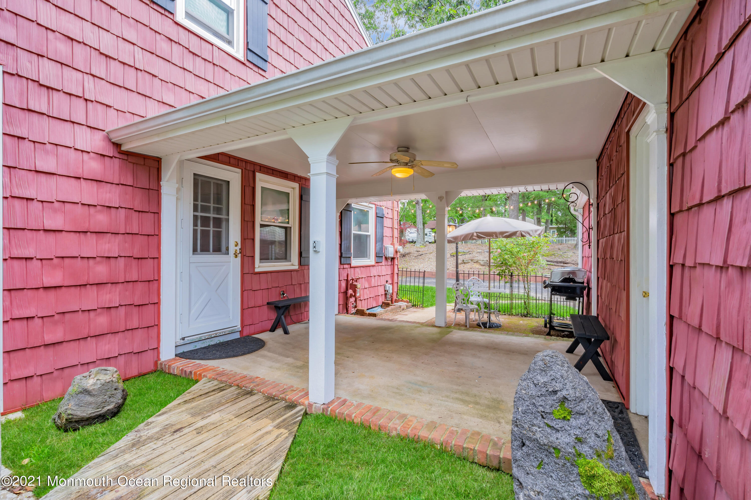 1675 Forge Pond Road Brick, NJ 08724 - Photo 57 of 69 a front view of a house with a garden and patio