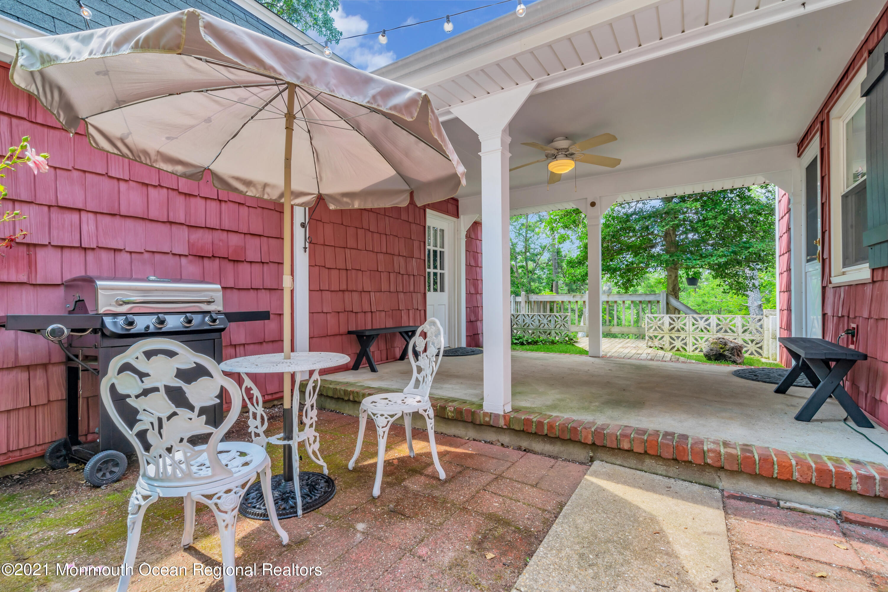1675 Forge Pond Road Brick, NJ 08724 - Photo 58 of 69 a view of a patio with table and chairs under an umbrella