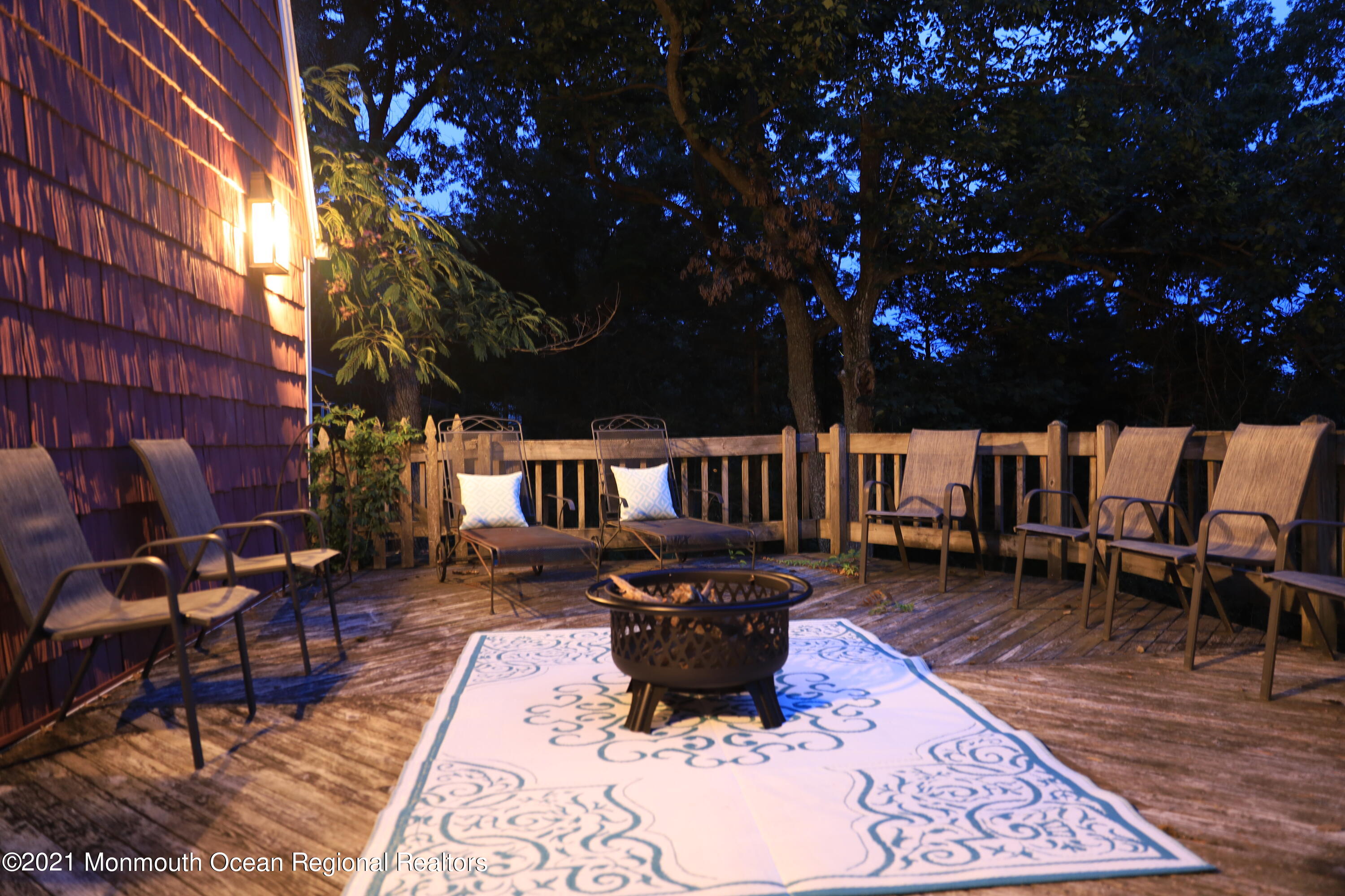 1675 Forge Pond Road Brick, NJ 08724 - Photo 62 of 69 a view of a patio with a table chairs and a fire pit