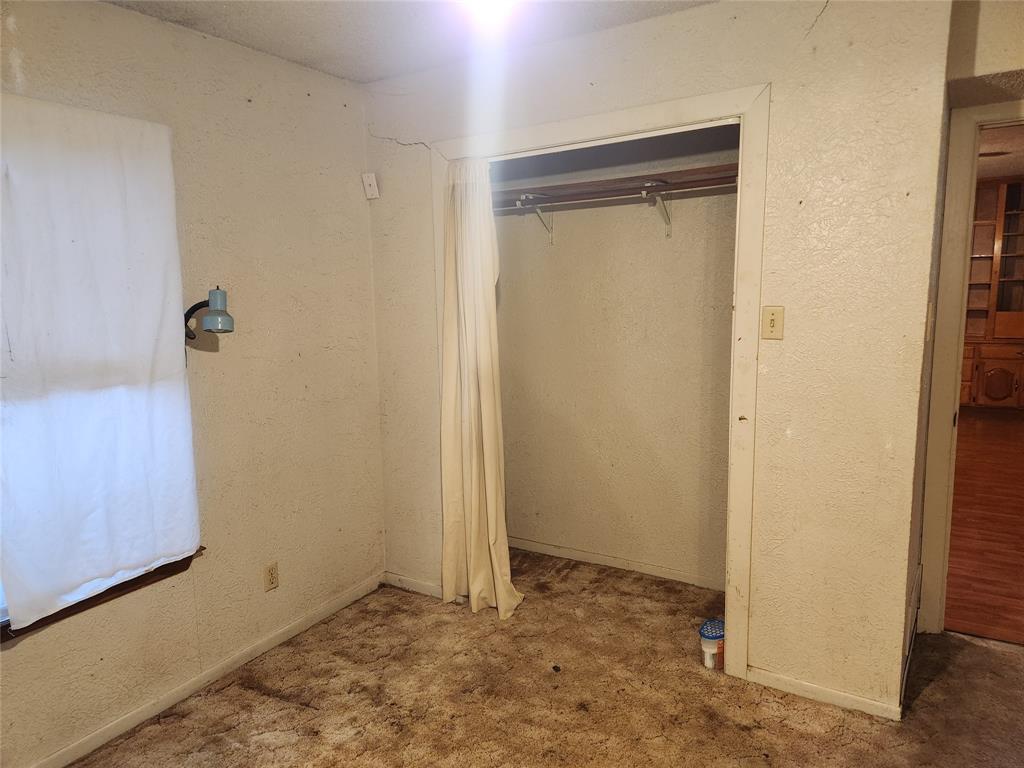 209 East 2nd Street Quinlan, TX 75474 - Photo 12 of 13 a view of an empty room