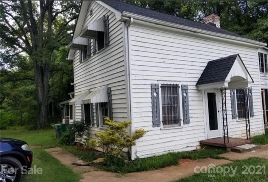 5226 Tuckaseegee Road Charlotte, NC 28208 - Photo 2 of 18 a front view of a house with a yard