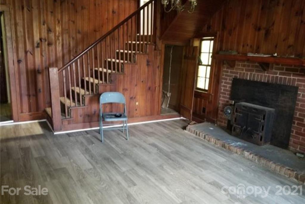 5226 Tuckaseegee Road Charlotte, NC 28208 - Photo 6 of 18 a view of an entryway with fireplace