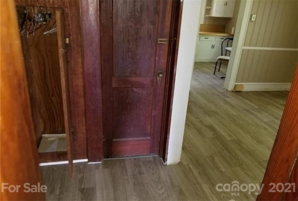 5226 Tuckaseegee Road Charlotte, NC 28208 - Photo 9 of 18 a view of a hallway with wooden door