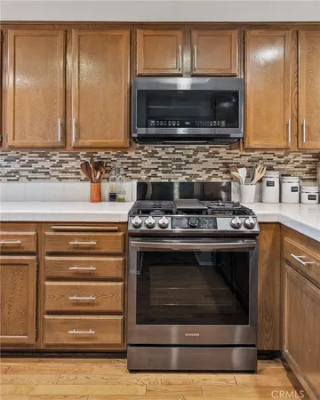 an empty room with closet and wooden floor
