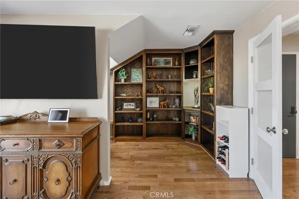 a living room with furniture a couch and cabinets