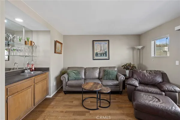 a bedroom with furniture and a flat screen tv