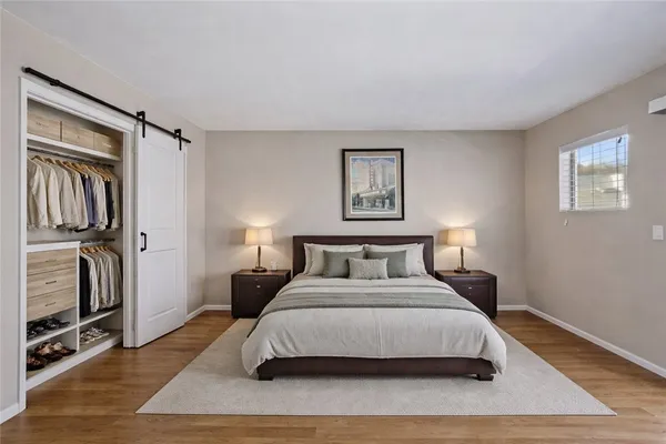 a view of a workspace with furniture and a flat screen tv