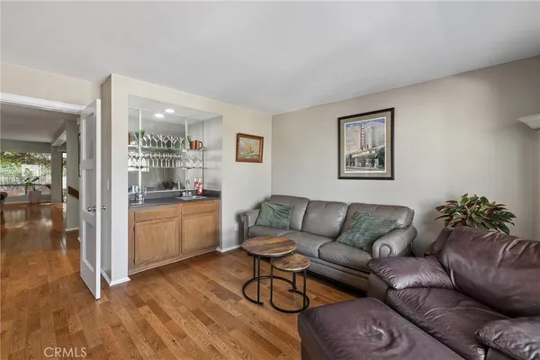 a bedroom with a bed and flat screen tv