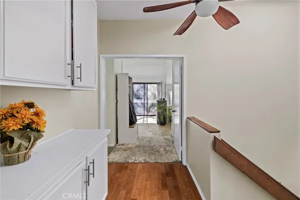a bathroom with a granite countertop sink a toilet a mirror and shower