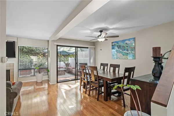 a living room with furniture a chandelier and a window