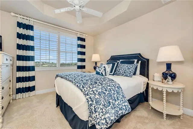 a bedroom with double bed and a window