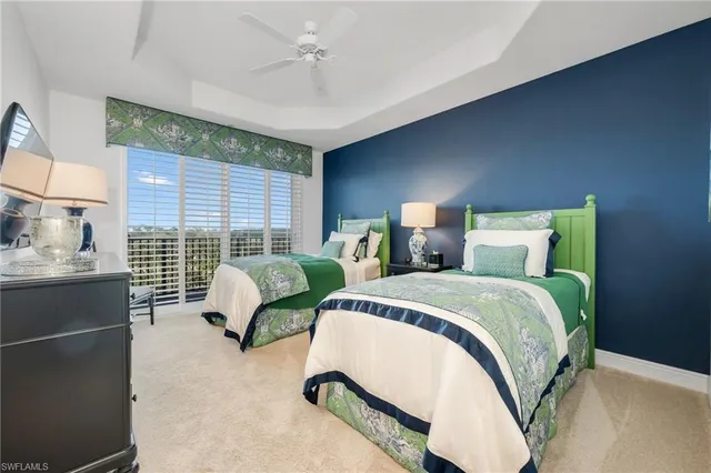 a spacious bedroom with a bed and a window