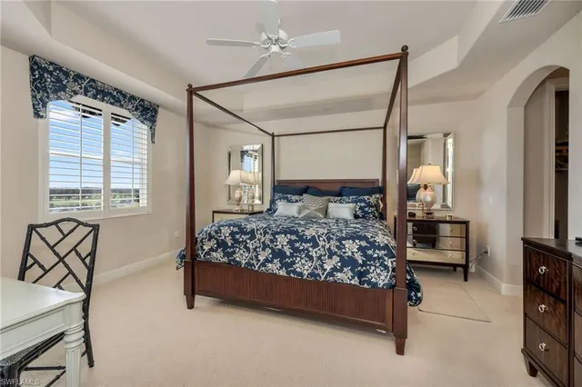 a bedroom with a bed chair and window