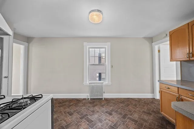 a view of a kitchen with a sink cabinets and a window