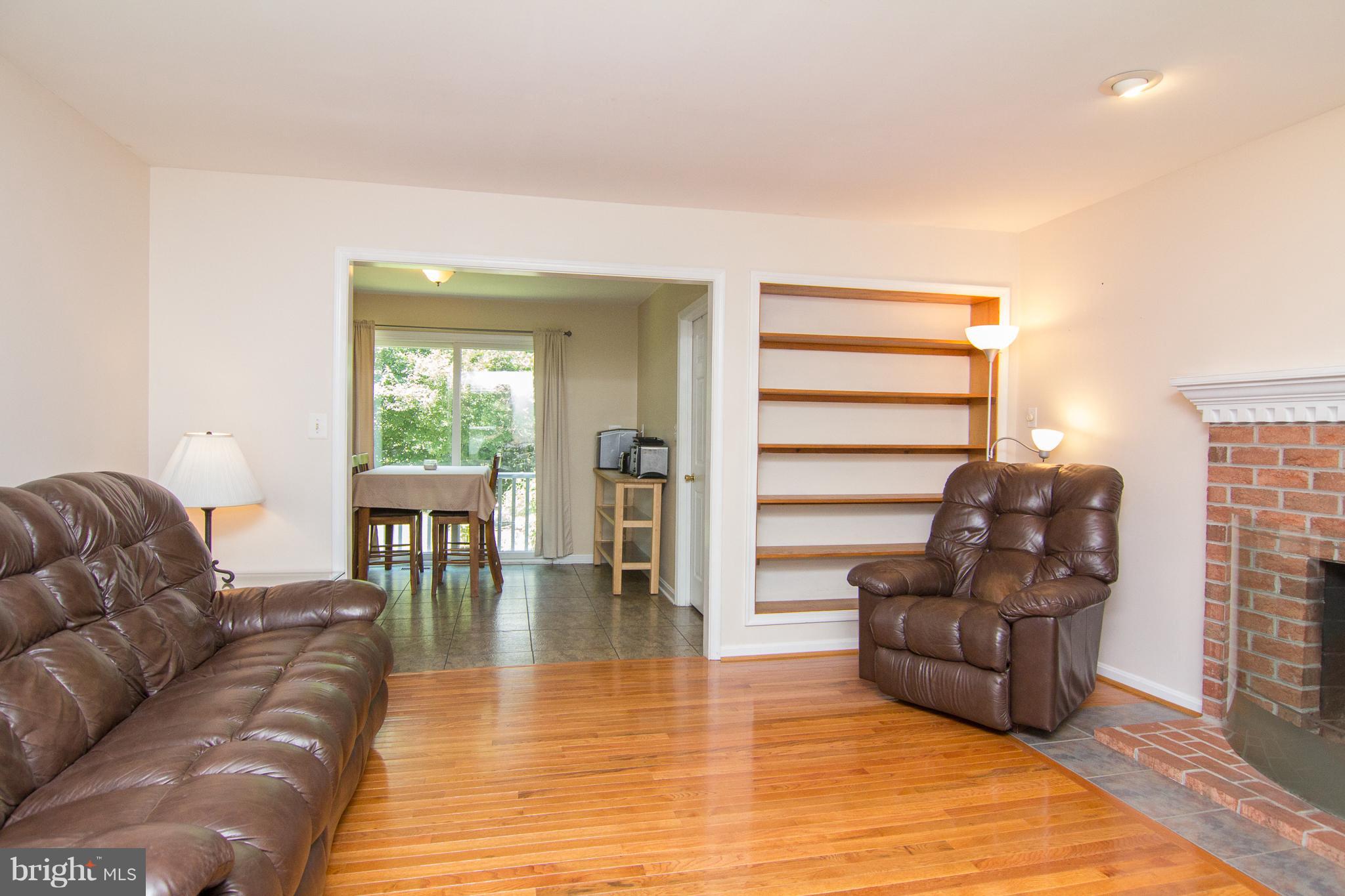 3480 Hooper Road New Windsor, MD 21776 - Photo 14 of 30 Family Rm has wd burning FP & built-in shelves