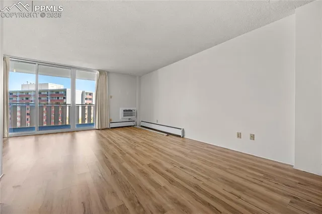 a view of a livingroom with wooden floor