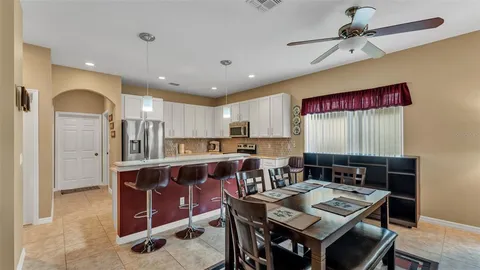 a view of a livingroom with furniture and a window