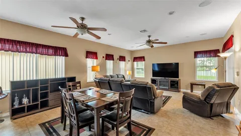 a kitchen with stainless steel appliances kitchen island granite countertop a sink and cabinets