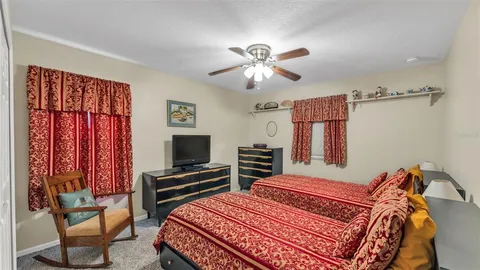 a view of a house with backyard porch and sitting area