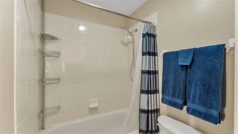 an aerial view of a house with garden space and street view