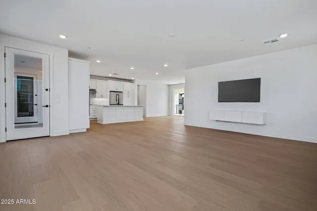 a kitchen with stainless steel appliances a sink stove and refrigerator
