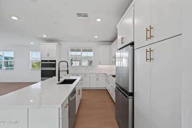 a view of kitchen with furniture and wooden floor