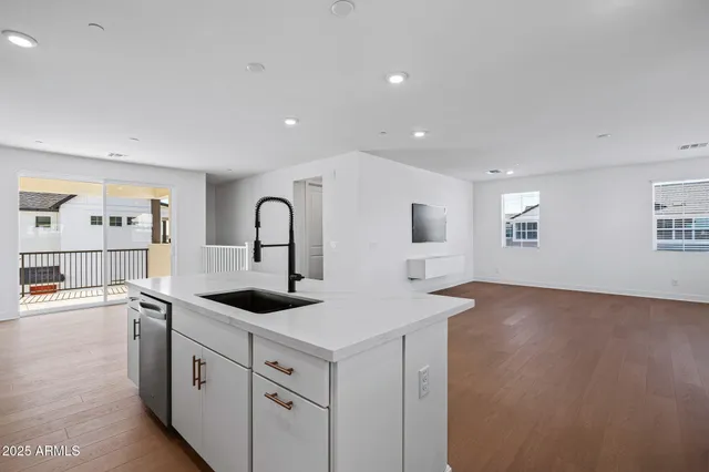 a view of entryway with wooden floor and windows