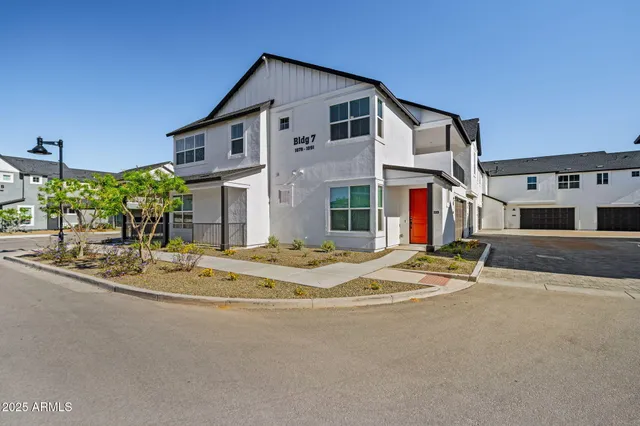 a house with palm trees in front of it