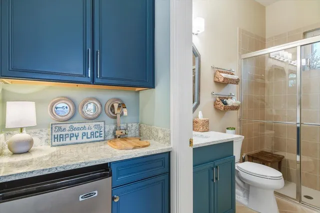 a bathroom with a toilet a sink and a shower