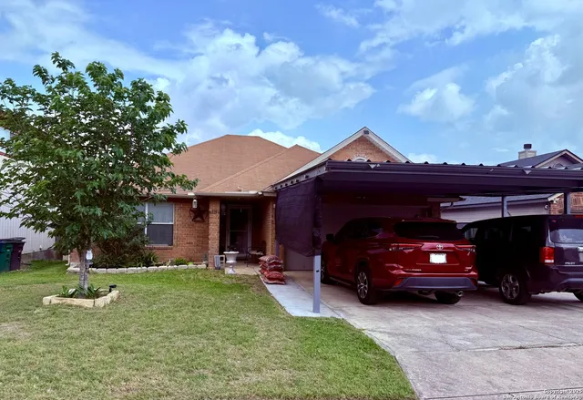 a view of a car parked in front of a house