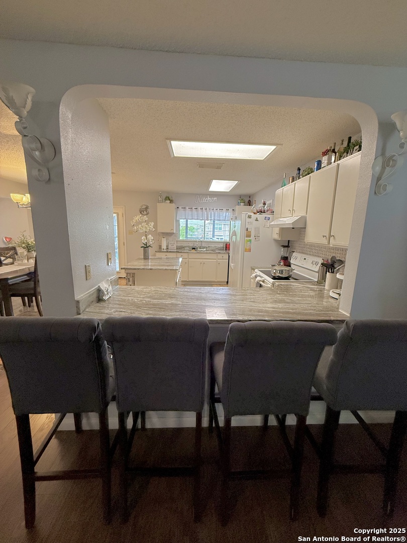 6719 Raintree Path San Antonio, TX 78233 - Photo 12 of 24 a dining room with furniture and window