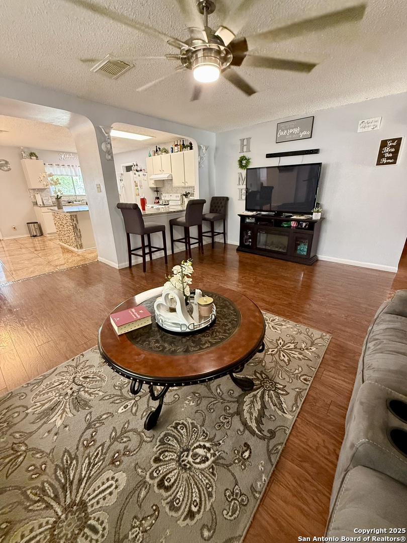 6719 Raintree Path San Antonio, TX 78233 - Photo 6 of 24 a living room with furniture and a dining table