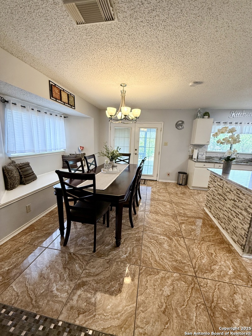 6719 Raintree Path San Antonio, TX 78233 - Photo 7 of 24 a view of a dining room with furniture