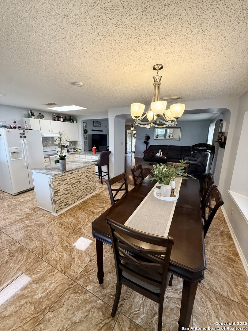 6719 Raintree Path San Antonio, TX 78233 - Photo 8 of 24 a living room with furniture and kitchen view