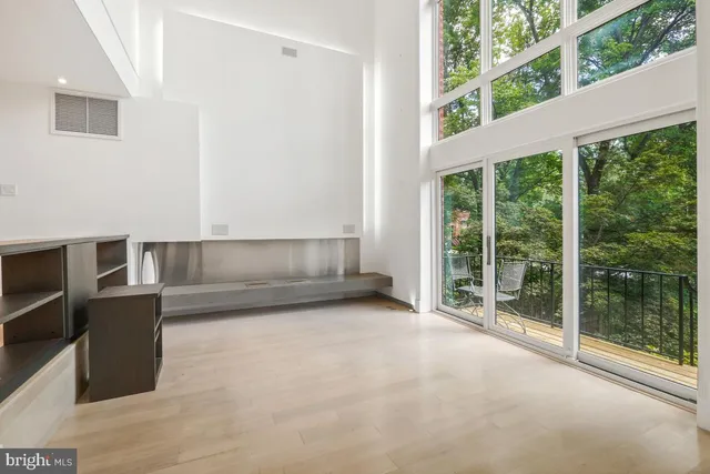 a view of a livingroom with table & cabinets