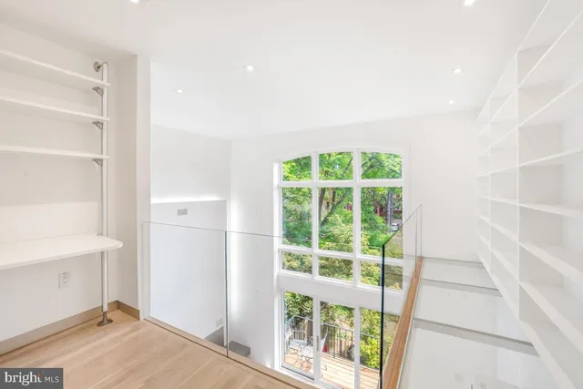 a bathroom with a granite countertop sink a toilet and a shower