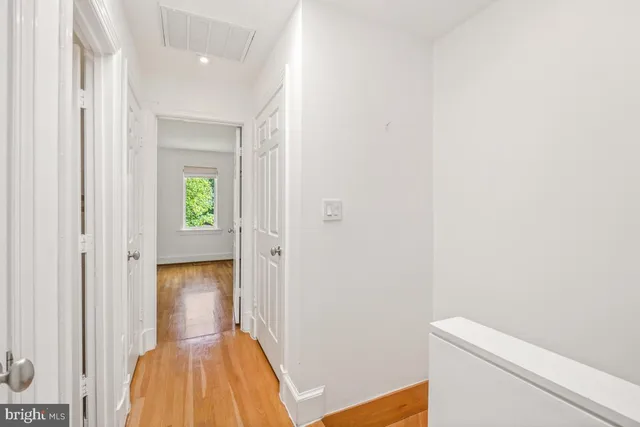 a view of room with window and hardwood floor