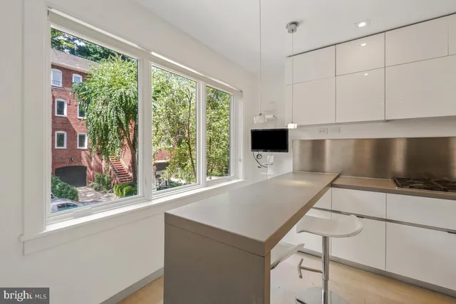 a view of a livingroom with furniture and window