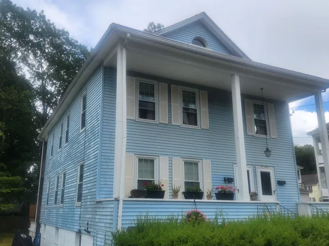 a view of house with yard
