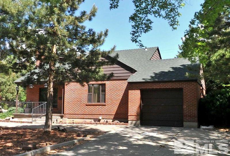 a house with a tree in front of it