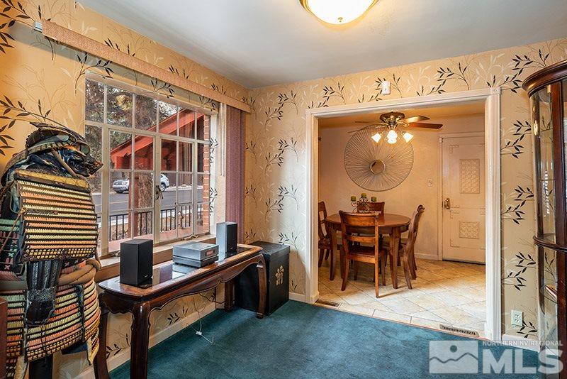 844 Whitaker Drive Reno, NV 89503 - Photo 19 of 34 a view of a dining room with furniture and chandelier