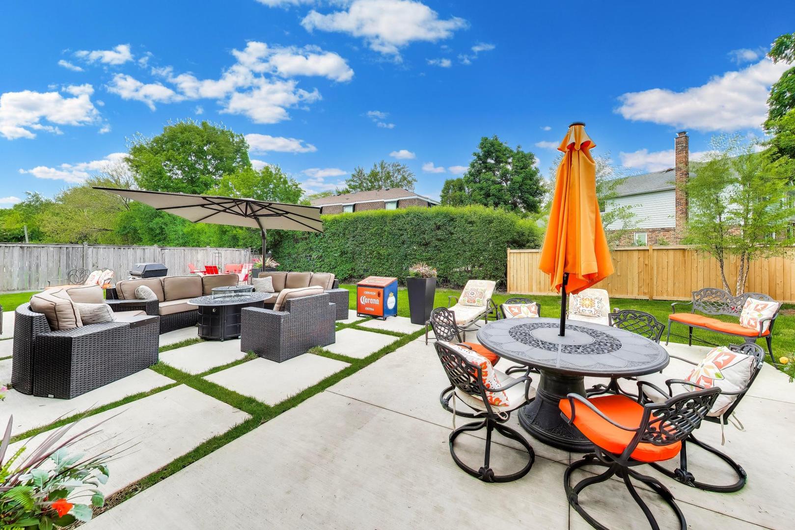 3956 Rutgers Lane Northbrook, IL 60062 - Photo 38 of 41 a view of a patio with a dining table and chairs with a small yard