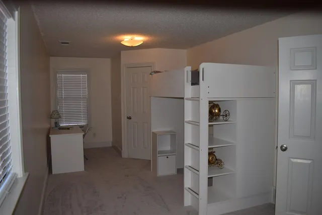 a view of walk in closet with window