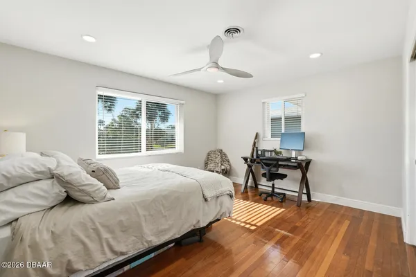 a bedroom with a bed and a table