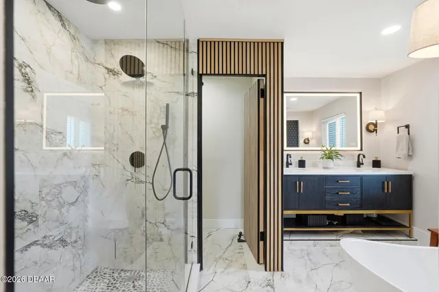 a bathroom with a shower and a sink