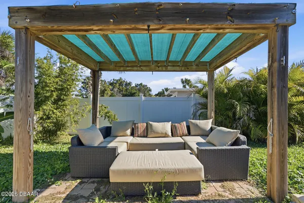 a outdoor living space with furniture and garden view