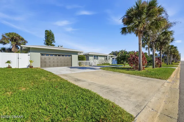 a house view with a garden space