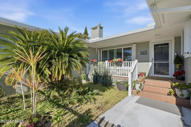 a front view of a house with a porch
