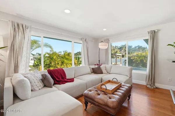 a living room with furniture and a large window