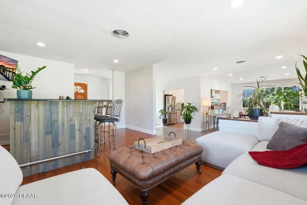 a living room with furniture and a rug